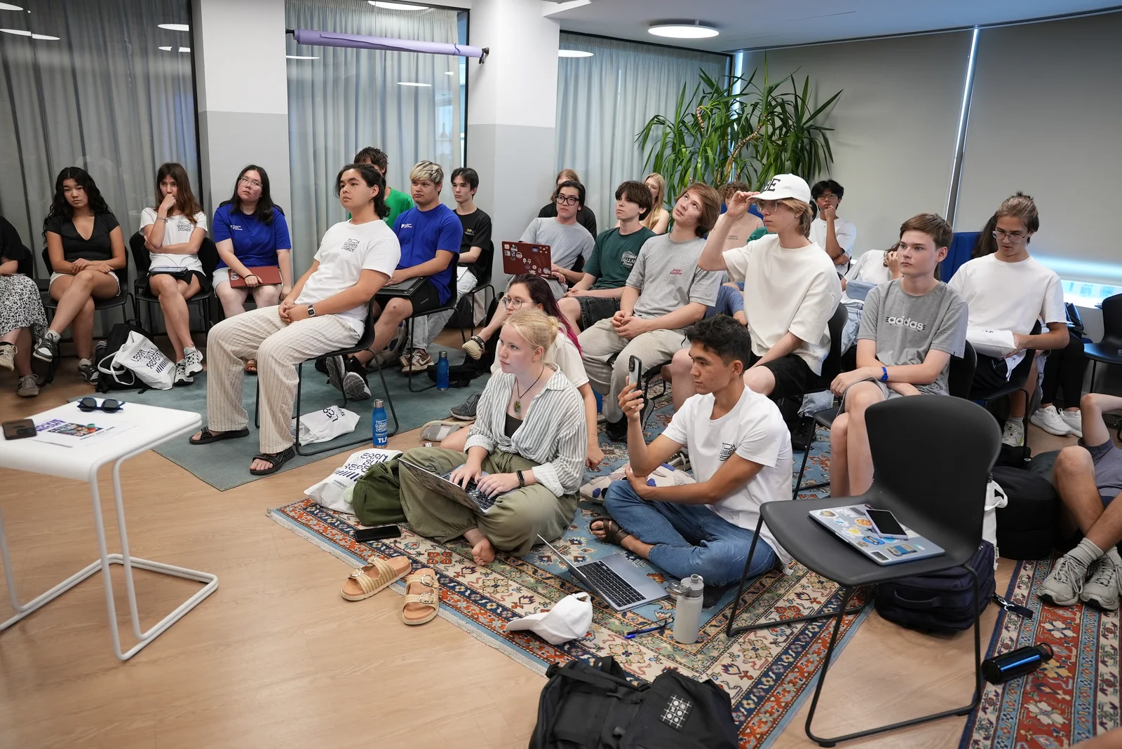 Students listening during a camp session