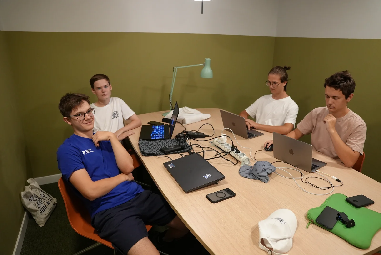Students working together around a table at Barcelona Camp